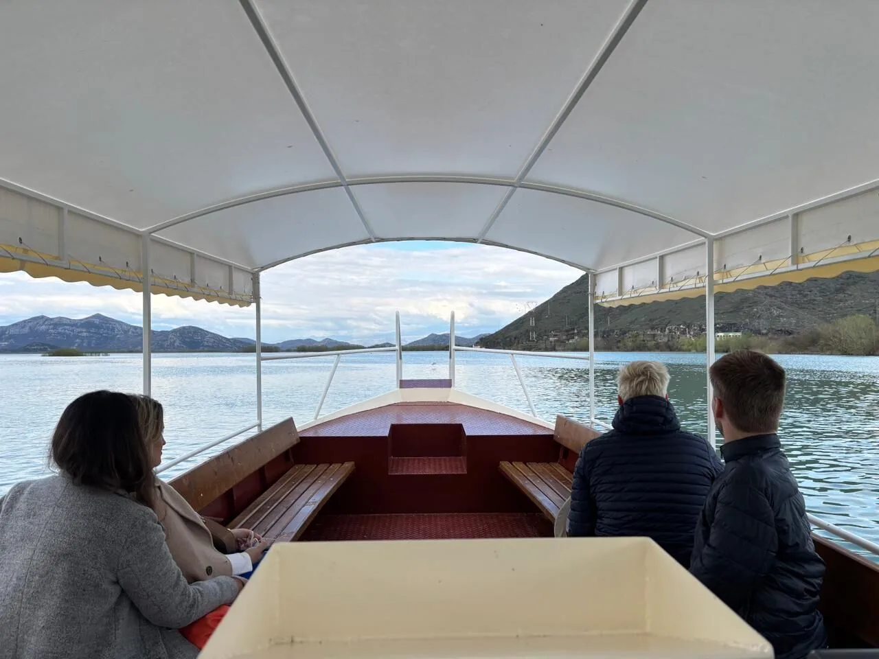 Boat tour on Skadar Lake with mountain panorama